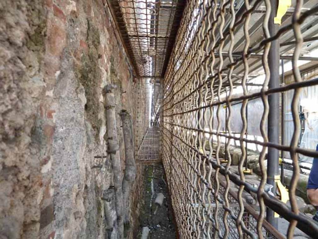 Vicolo di Mercurio. May 2010. Ancient water pipes on the edge of the road at the north end of VI.13.