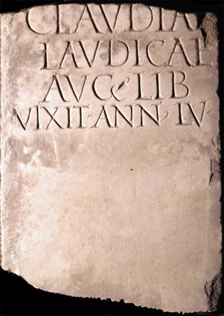 Pompei, Tombe presso la Strada Regia. Found in 1883 or a little earlier. Marble columella of Claudiae Laudicae.
Now in Naples Archaeological Museum. Inventory number 123256.
It was 1m high and 0.26m wide, broken at the top and with a circular hole towards the base.
According to Mau, it was found in the Fondo Santilli, around 1883 or a little earlier, more towards the city, immediately south of the road, at the meeting point of the old and the new road.  It may have been from a monument on the opposite side of the ancient road, facing the tomb now discovered.
See Mittheilungen des Kaiserlich Deutschen Archaeologischen Instituts, Roemische Abtheilung, 1894, p. 65.
It bore an inscription already published by Novi and reproduced in Ephemeris Epigraphica. Sogliano published it again and confirmed its authenticity and noted that the manuscript copy of Novi was not exact in the distribution of the lines.
See Ephemeris Epigraphica, Vol. VIII, 1899, p. 87, no. 319.

CLAVDIAE
LAVDICAE
AVG � LIB
VIXIT � ANN � LV �

Claudiae
Laudicae
Aug(usti) lib(ertae)
vixit ann(is) LV

Burial of a freedwoman.
See Notizie degli Scavi di Antichit�, 1893, p. 334 no. 13.

Cooley translates this as 

To Claudia Laudica, freedwoman of Augustus. Lived 55 years.       [EE VIII no. 319]

See Cooley, A. and M.G.L., 2004. Pompeii: A Sourcebook. London: Routledge, G35, p. 148.
