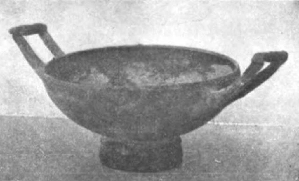 Pompeii Fondo Azzolini. Samnite Tomb IV. Terracotta kylix in black glaze.
Found at a depth of 1 m between tombs II and III. The skeleton lay on the bare ground, protected by ten tiles, four on each side, forming two roof planes, and one for each end. Found between the feet of the skeleton: A terracotta kylix in black glaze, 0.10 m in diameter.
See Notizie degli Scavi di Antichità, 1911, p. 110, fig. 6.
Nine tombs had single coins found in them but this tomb was one of only two that had two coins found in them. One was found in the right hand of the deceased. The second was found in the mouth of the deceased.
See Notizie degli Scavi di Antichità, 1916, p. 295.
