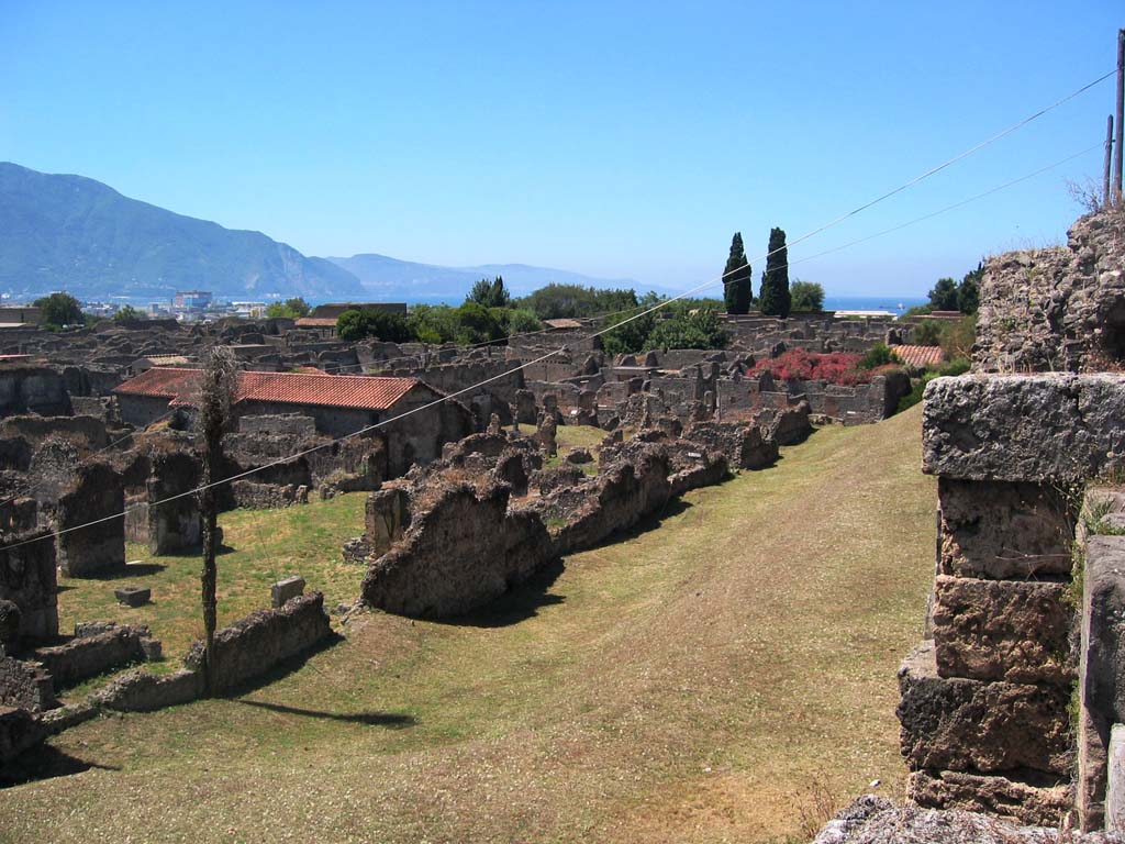 Tower X, Pompeii, on right. July 2008. Looking south-west across north end of VI.11 towards Sorrentine Peninsula. 
VI.11.19/20 is seen on the left. Photo courtesy of Barry Hobson.
