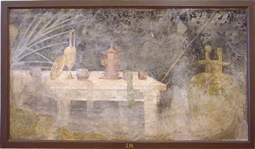 Villa of P Fannius Synistor at Boscoreale. Peristyle E, south wall, west end. Wall painting of marble table with athletic prizes. Now in Naples Archaeological Museum.  Inventory number s.n.6.