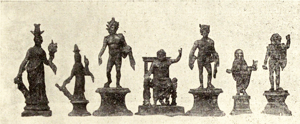 Boscoreale, La villa del Fondo Acunzo. 1903. Room 12.  Podium “y”.
Group of seven bronze statuettes found on podium built against the east wall of the room which opened off the kitchen 8: 
Centre: Jupiter seated
To the left: Helios with radiant crown
Furthest left: Two figures of differing sizes representing Isis-Fortuna
To the right of Jupiter: Mercury or a young nude faun with pan pipes 
Further right: Genius familiaris wearing a toga
Right hand end: Standing Jupiter or Neptune with arm raised

See Notizie degli Scavi di Antichità, 1921, p. 440-1, fig.11.
See Boyce G. K., 1937. Corpus of the Lararia of Pompeii. Rome: MAAR 14.  (p.100, no.500B).
