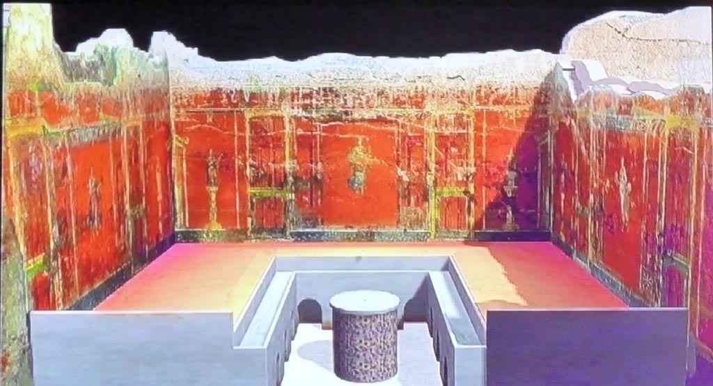 Complesso dei triclini in località Moregine a Pompei. September 2015. Triclinium A as shown on a display in the Palaestra.
A small channel ran around inside the triclinium and was fed by 14 water jets.
The base of the round table was painted with plants, flowers and fruits, and the floor was covered with mosaic.