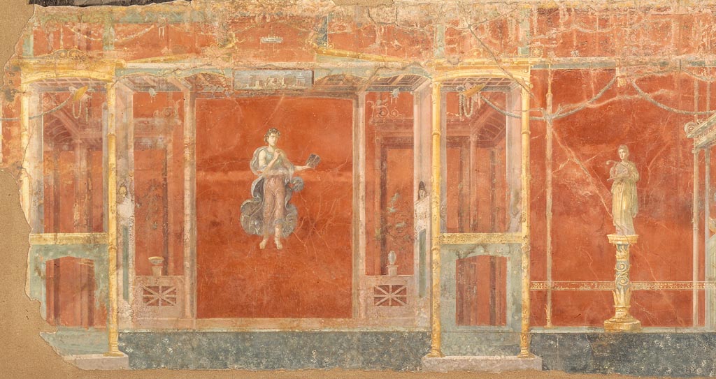 Complesso dei triclini in località Moregine a Pompei. Triclinium A, west wall with the muses Calliope and Terpsichore.
Unlike the other triclinii this wall only has two figures remaining.
According to Nappo, the lack of the left figure on the west wall is strange in that no fragments were found on the ground that would suggest that the fresco collapsed at this point, among other things in archive photo no. 2400 you can clearly see the upper part of the middle zone still in situ, but in photo n. 2472 the wall already shows the large gap with a very rudimentary locking system that holds the central figure. In fact it seems to have been detached, unfortunately there are no traces of all this either in the excavation diaries or in the deposits.
Secondo Nappo, la mancanza della figura di sinistra della parete ovest è strana in quanto non si sono trovati a terra frammenti che facessero supporre un crollo dell’affresco in questo punto, tra l’altro nella foto d’archivio n. 2400 si vede chiaramente la parte alta della zona mediana ancora in situ, ma nella foto n. 2472 la parete mostra già l’ampia lacuna con un sistema di bloccaggio molto rudimentale che tiene la figura centrale. In effetti sembra che sia stata staccata, purtroppo non ci sono tracce di tutto questo né nei diari di scavo né nei depositi.
See/Vedi Nappo, S. C., 2001. La decorazione parietale dell'hospitium dei Sulpici in località Murecine a Pompei MEFR Antiquité, tome 113, n°2. 2001, p. 864.