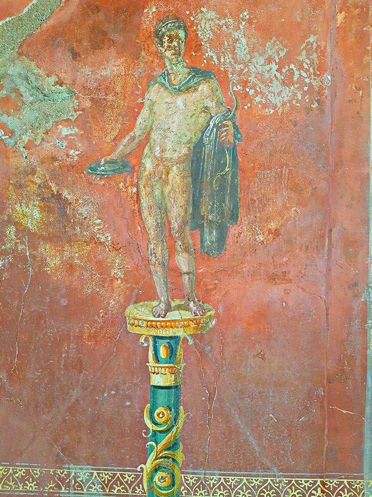 Complesso dei triclini in località Moregine a Pompei. September 2024.
Triclinium C, north wall. Nude male offer-bearer with plate in right hand and bow in left.
Photo courtesy of Giuseppe Ciaramella.