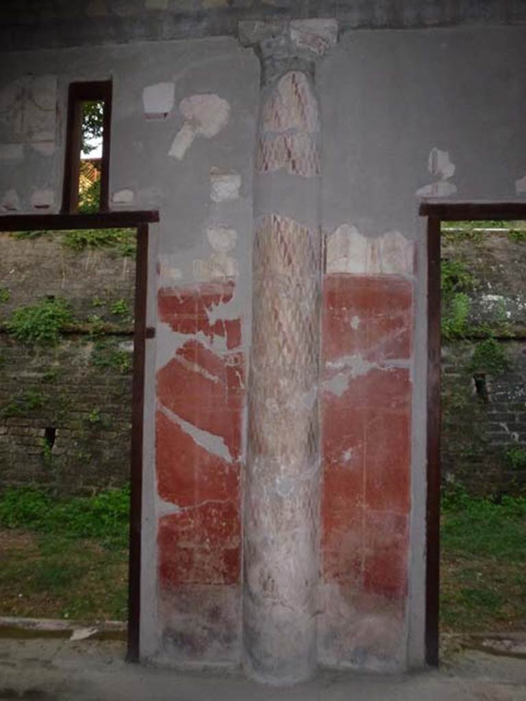 Oplontis, September 2011. Room 24, interior half-column embedded into the wall. 
Photo courtesy of Michael Binns. Malandrino describes - “the southern portico with columns painted on the inside and fluted in stucco on the outside. The spaces between the columns were partially closed by masonry panels to protect both the porticoes themselves as well as the rooms that face onto them, from the summer heat and from the rain and the southerly winds.”
See Malandrino, C. (1978). Oplontis, (p. 72), where Room 24, is described as Room19 on the plan).

