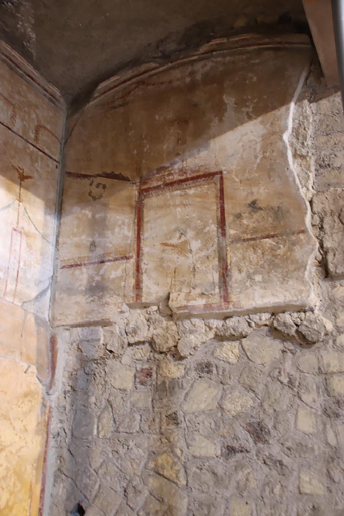 Oplontis Villa of Poppea, May 2024. 
Room 27, detail of painted north wall at side of lararium. Photo courtesy of Klaus Heese.
