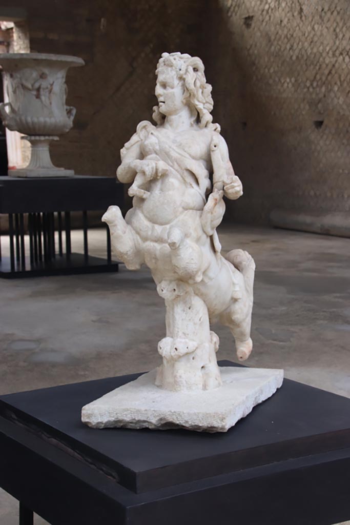 Villa of Poppaea, Oplontis, October 2023. 
One of a group of four centaurs, a female holding a club and lyre, on display in Room 21.
Photo courtesy of Klaus Heese. 
