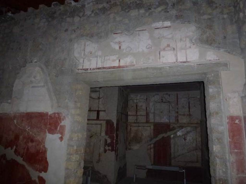 Oplontis, September 2011. Room 41, cubiculum. Looking through doorway in north wall of portico 24, with painted decoration above the doorway. Photo courtesy of Michael Binns.