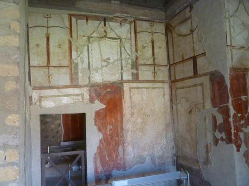 Oplontis, May 2011. Room 41, painted decoration on west and north wall of the alcove on the west side of the room. The small doorway leads into room 38. Photo courtesy of Michael Binns.
