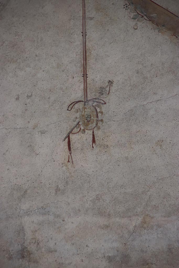 Villa of Poppaea, Oplontis, October 2023. 
Area 60, detail of painted decoration from west portico wall, on left above doorway to room 72.
Photo courtesy of Klaus Heese. 
