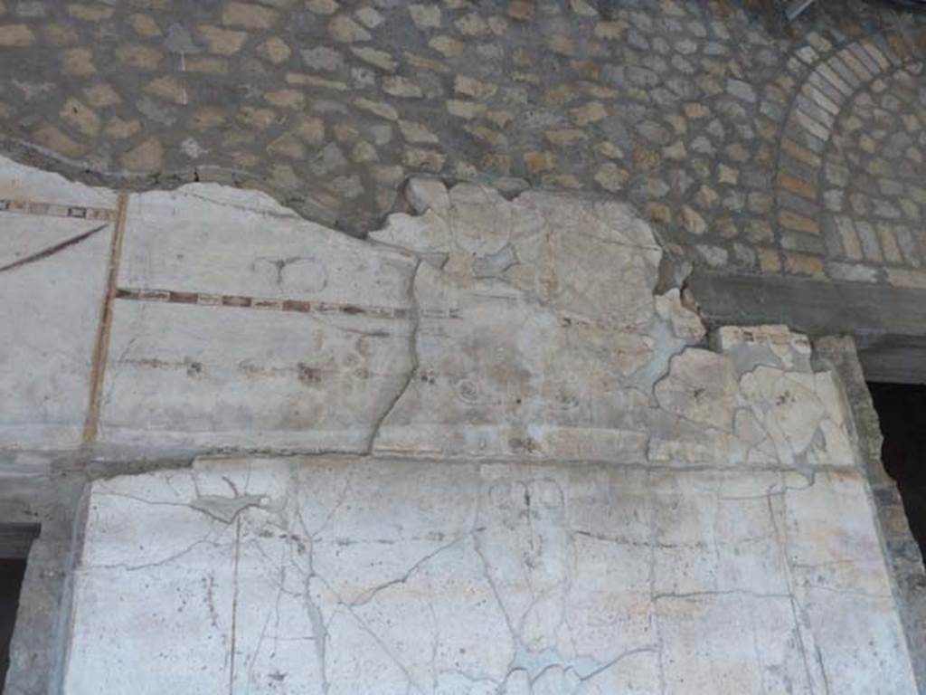 Oplontis, September 2015. Portico 60, painted upper west wall between doorways to rooms 72, on left, and 74, on right.