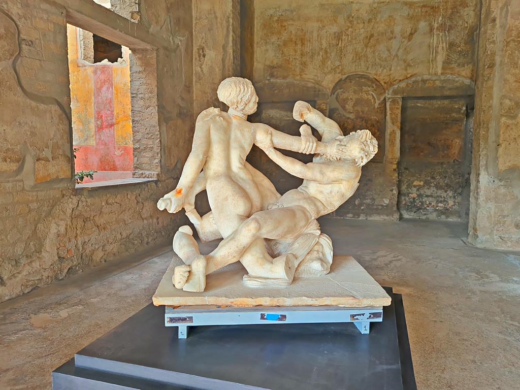 Oplontis Villa of Poppea, October 2023. Room 74, looking south-west towards window into garden room 70, on left.
The marble group of Hermaphrodite and Satyr, on display here, were found on th south side of the pool. Photo courtesy of Giuseppe Ciaramella.