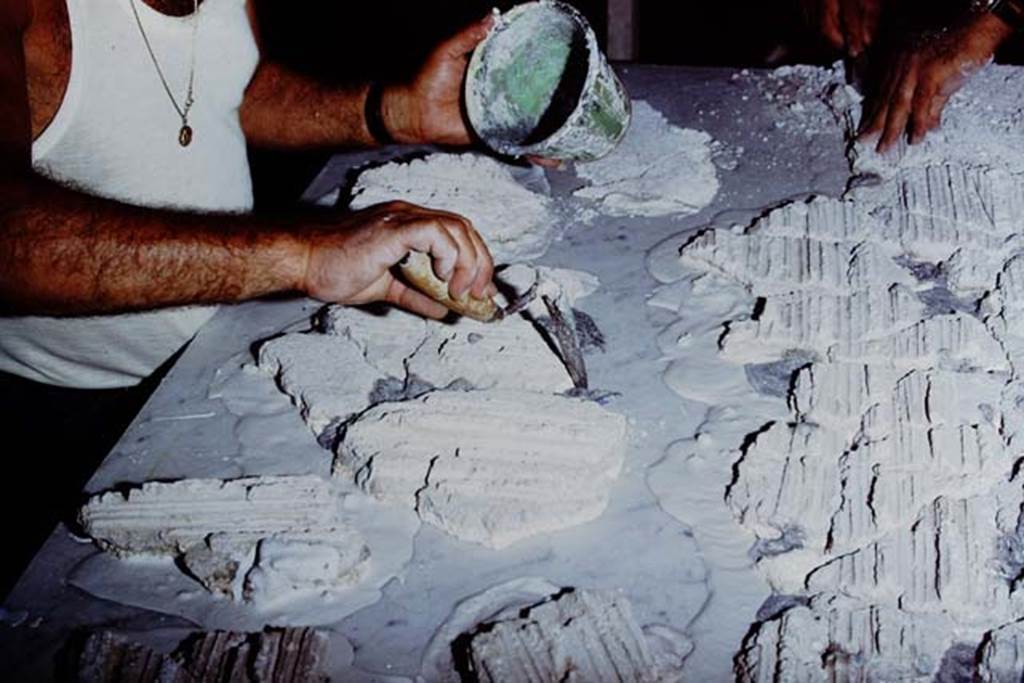 Oplontis Villa of Poppea, 1975 or 1974. Restoration in progress. Photo by Stanley A. Jashemski.   
Source: The Wilhelmina and Stanley A. Jashemski archive in the University of Maryland Library, Special Collections (See collection page) and made available under the Creative Commons Attribution-Non Commercial License v.4. See Licence and use details. J74f0878
