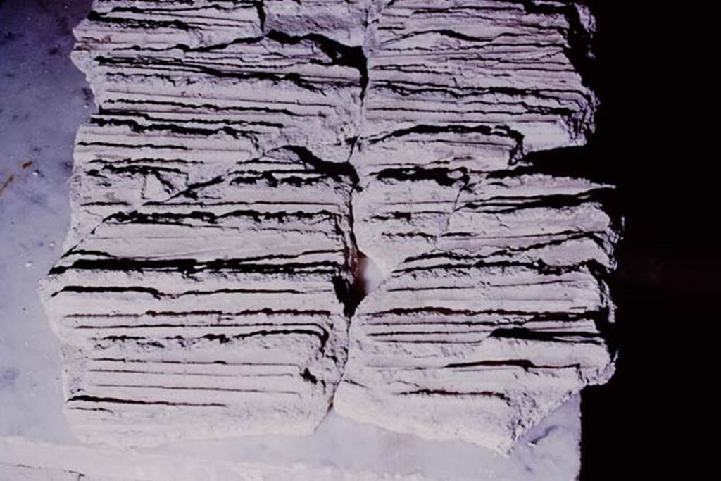 Oplontis, 1975. Carefully and with great skill, attaching the matching patterns of the reeds. Photo by Stanley A. Jashemski.   
Source: The Wilhelmina and Stanley A. Jashemski archive in the University of Maryland Library, Special Collections (See collection page) and made available under the Creative Commons Attribution-Non Commercial License v.4. See Licence and use details. J75f0118
