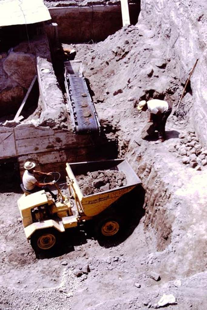 Oplontis, 1975. Room 74, debris being removed from it, on the north side of room 72, with painted plaster.  Photo by Stanley A. Jashemski.   
Source: The Wilhelmina and Stanley A. Jashemski archive in the University of Maryland Library, Special Collections (See collection page) and made available under the Creative Commons Attribution-Non Commercial License v.4. See Licence and use details. J75f0098
