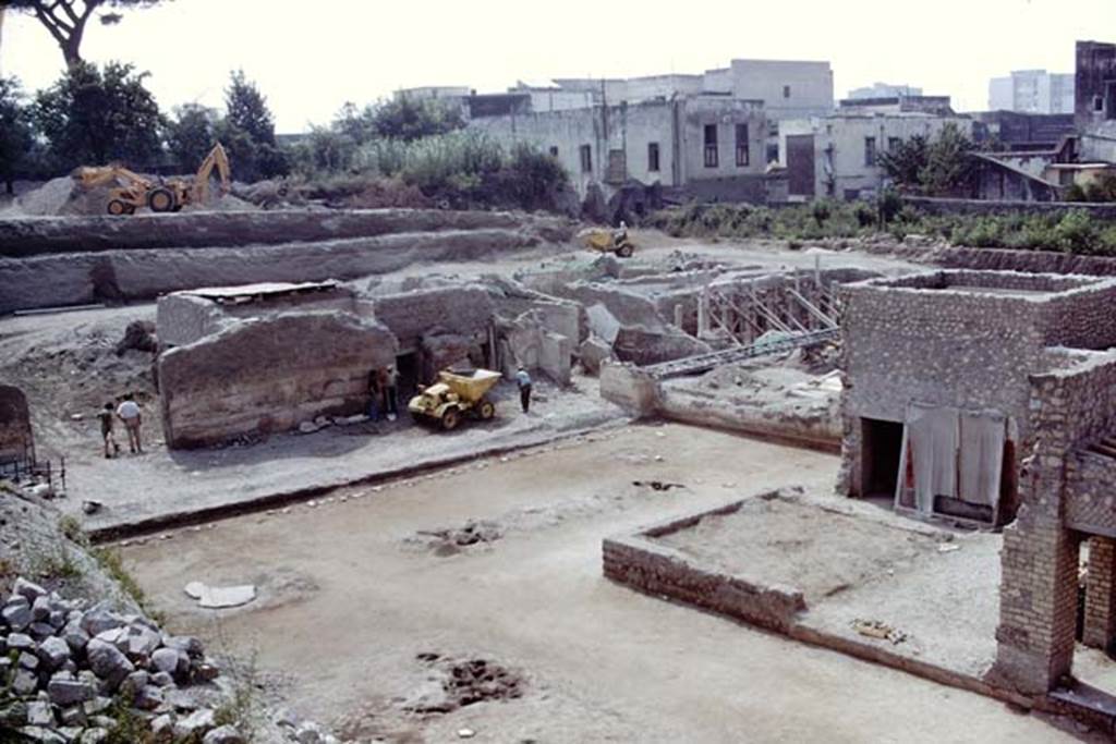 Oplontis, 1975. Looking south-east across cleaned east end of north garden, and towards doorway to room 69, on left, and east peristyle, centre right. 
Photo by Stanley A. Jashemski.   
Source: The Wilhelmina and Stanley A. Jashemski archive in the University of Maryland Library, Special Collections (See collection page) and made available under the Creative Commons Attribution-Non Commercial License v.4. See Licence and use details. J75f0222
