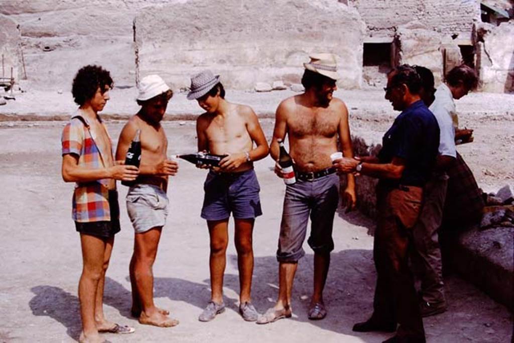 Oplontis, 1975. Celebrating a job well-done, with soft-drink. Photo by Stanley A. Jashemski.   
Source: The Wilhelmina and Stanley A. Jashemski archive in the University of Maryland Library, Special Collections (See collection page) and made available under the Creative Commons Attribution-Non Commercial License v.4. See Licence and use details. J75f0263
