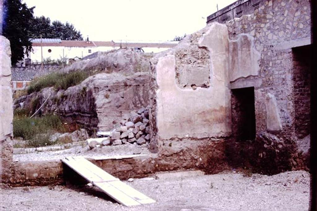 Oplontis 1976. Room 69, looking west through doorway to north garden, and on the right, the doorway to rooms 71 and 70. Photo by Stanley A. Jashemski.   
Source: The Wilhelmina and Stanley A. Jashemski archive in the University of Maryland Library, Special Collections (See collection page) and made available under the Creative Commons Attribution-Non Commercial License v.4. See Licence and use details. J76f0383
