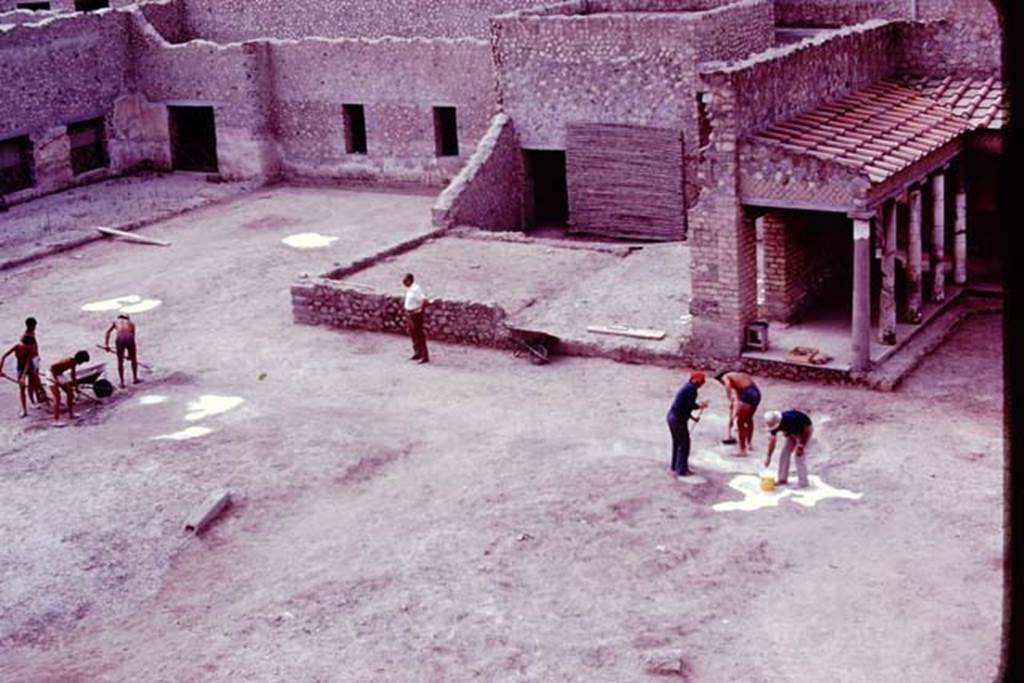 Oplontis, 1977. Cleaning and tidying the north garden, ready for the �balloon� photos. The root cavities are being painted white, to ensure they show up from the air. Photo by Stanley A. Jashemski.   
Source: The Wilhelmina and Stanley A. Jashemski archive in the University of Maryland Library, Special Collections (See collection page) and made available under the Creative Commons Attribution-Non Commercial License v.4. See Licence and use details. J77f0248
