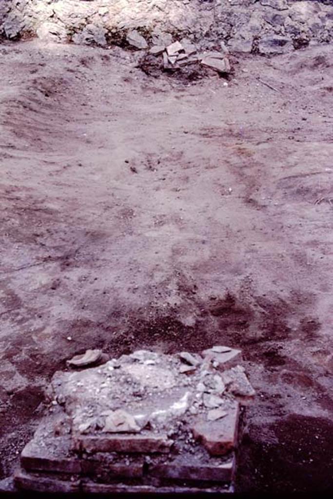 Oplontis, c.1984. Statue base IX, looking east into the lapilli and towards another base nearer the unexcavated lapilli, before root cavities were filled. The root-cavities behind this statue base were identified as that of oleanders.
Source: The Wilhelmina and Stanley A. Jashemski archive in the University of Maryland Library, Special Collections (See collection page) and made available under the Creative Commons Attribution-Non Commercial License v.4. See Licence and use details. Oplo0214
