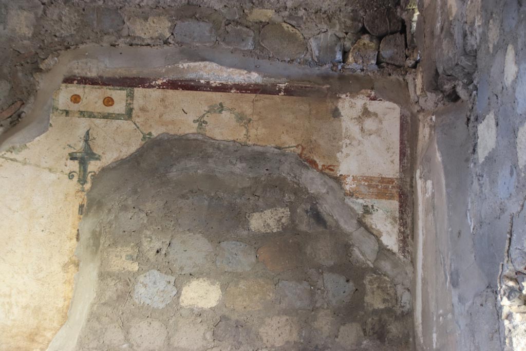 Stabiae, Villa Arianna, October 2022.  
Room M, painted decoration above doorway in south-west corner. Photo courtesy of Klaus Heese.
