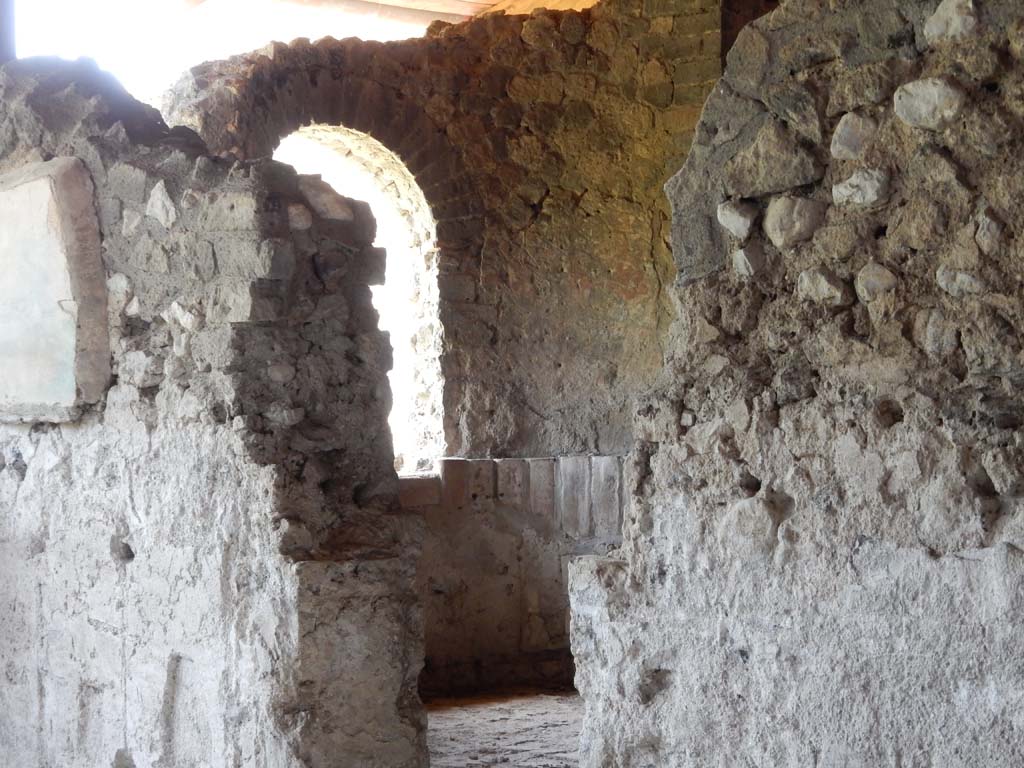 Stabiae, Villa Arianna, June 2019. 
Room 31, looking through doorway in north wall towards room 6, the caldarium. Photo courtesy of Buzz Ferebee. 
